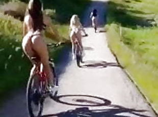 Kinky Girl with Naked Ass Rides the Bicycle Outdoors